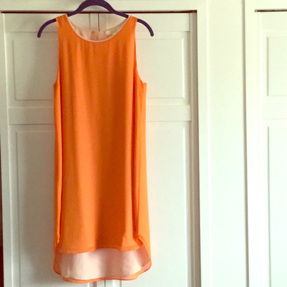 Orange colored dress.